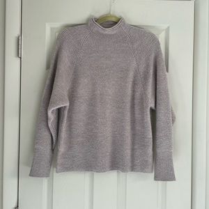 Tan Express mock neck sweater.